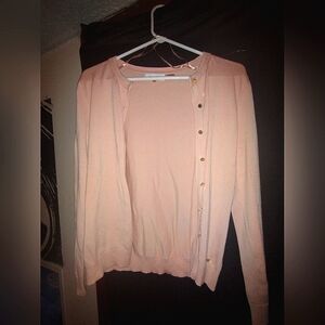 Light pink Calvin Klein cardigan.